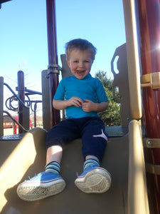 image of child on slide