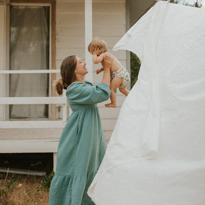 image of woman outside with baby