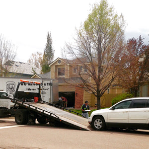 image of car getting towed