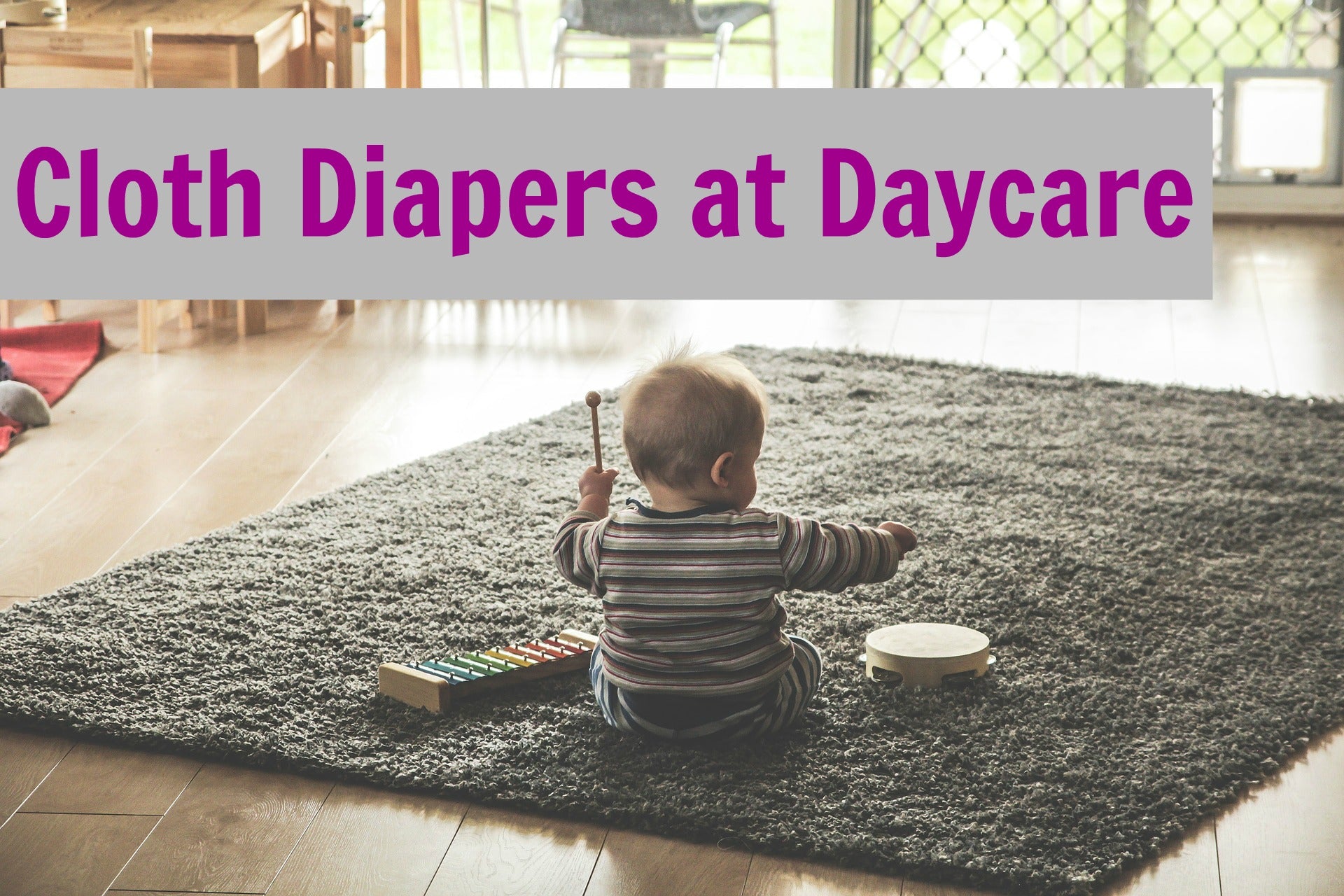 image of baby sitting on carpet