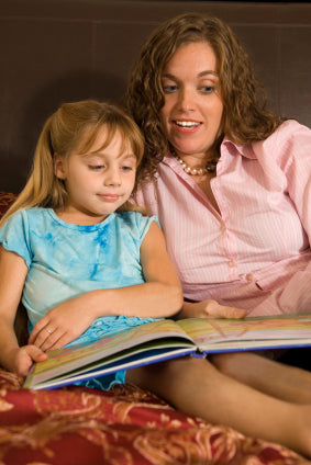 image of adult reading to child