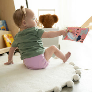 -Image of baby wearing Thirsties Cloth Diaper All in One in Crocus