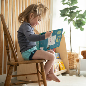 -Image of toddler wearing Thirsties resuable cloth Trainers made from organic cotton in lagoon