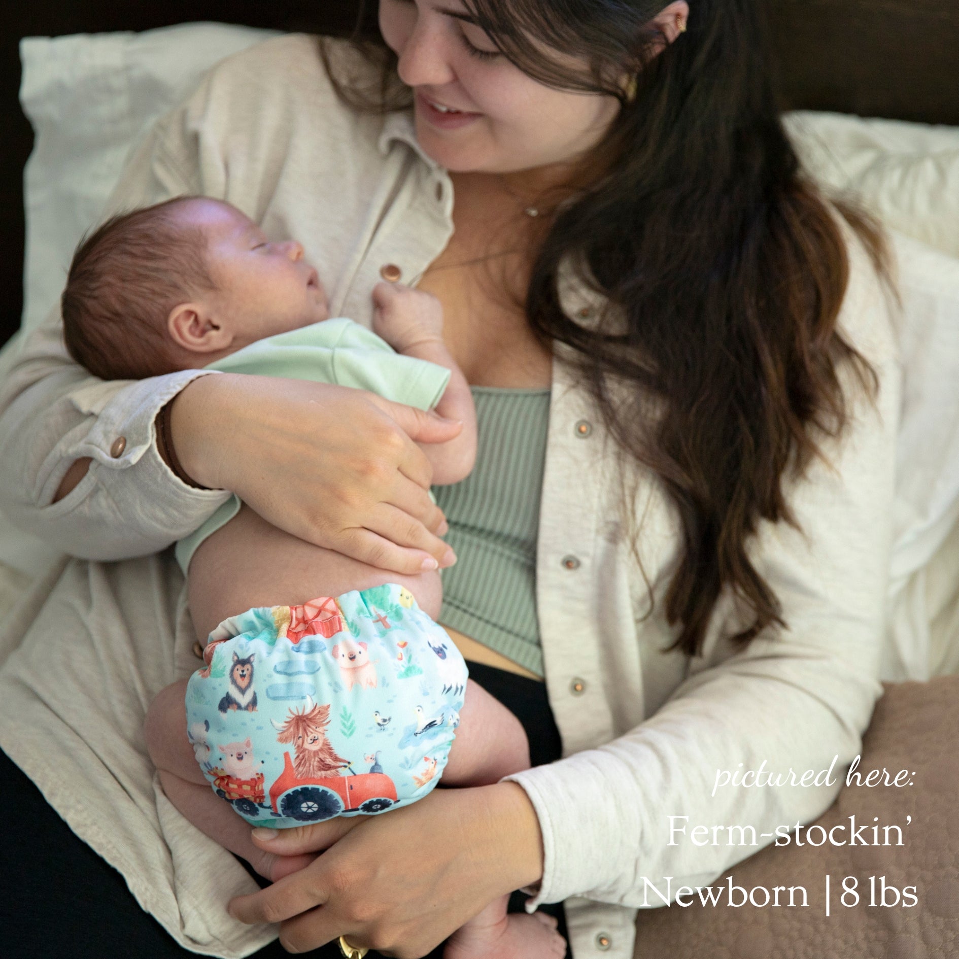 -Image of a newborn wearing a Thirsties Newborn All in One in Ferm-stockin
