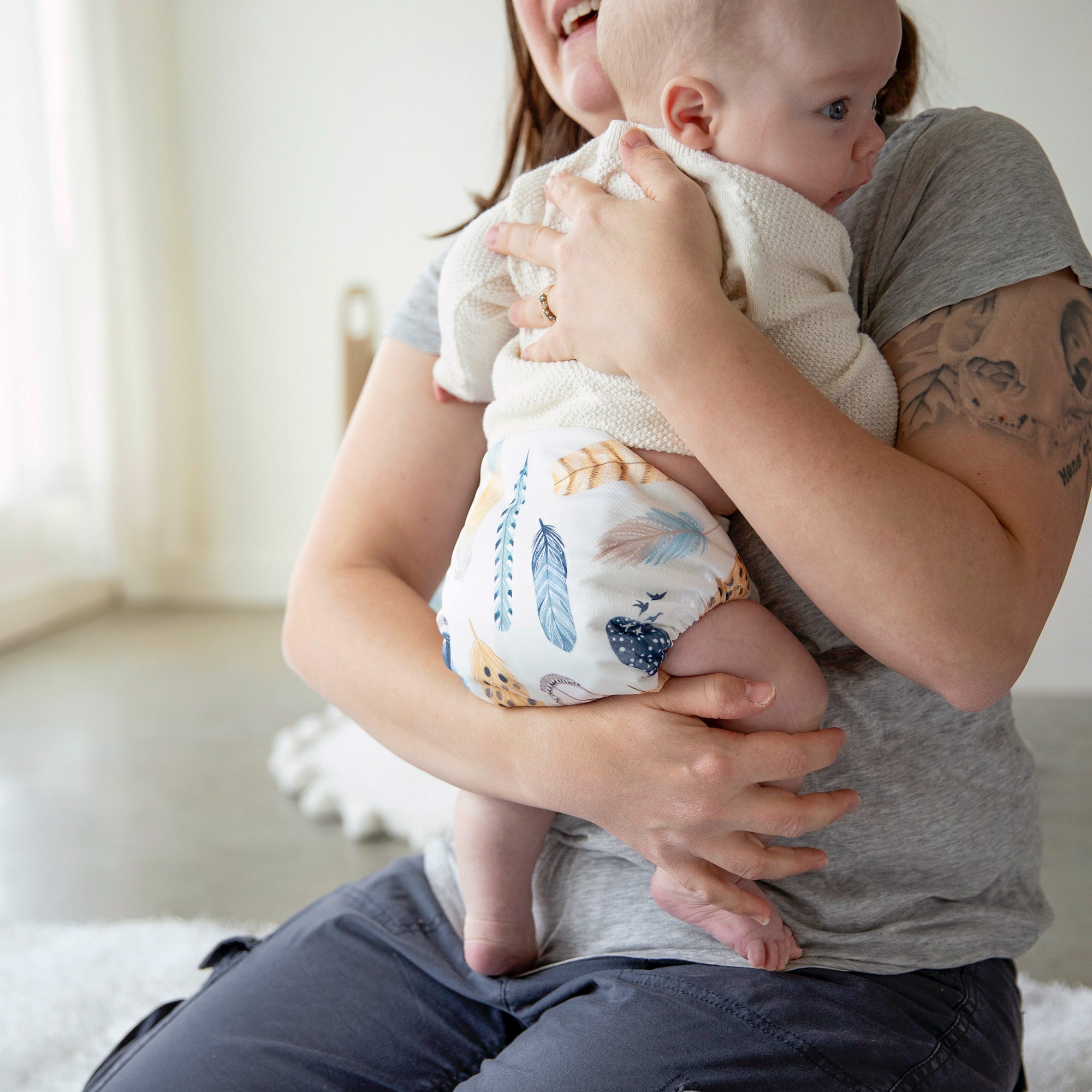 Image of baby wearing a Thirsties Cloth Diaper in Wild Plume
