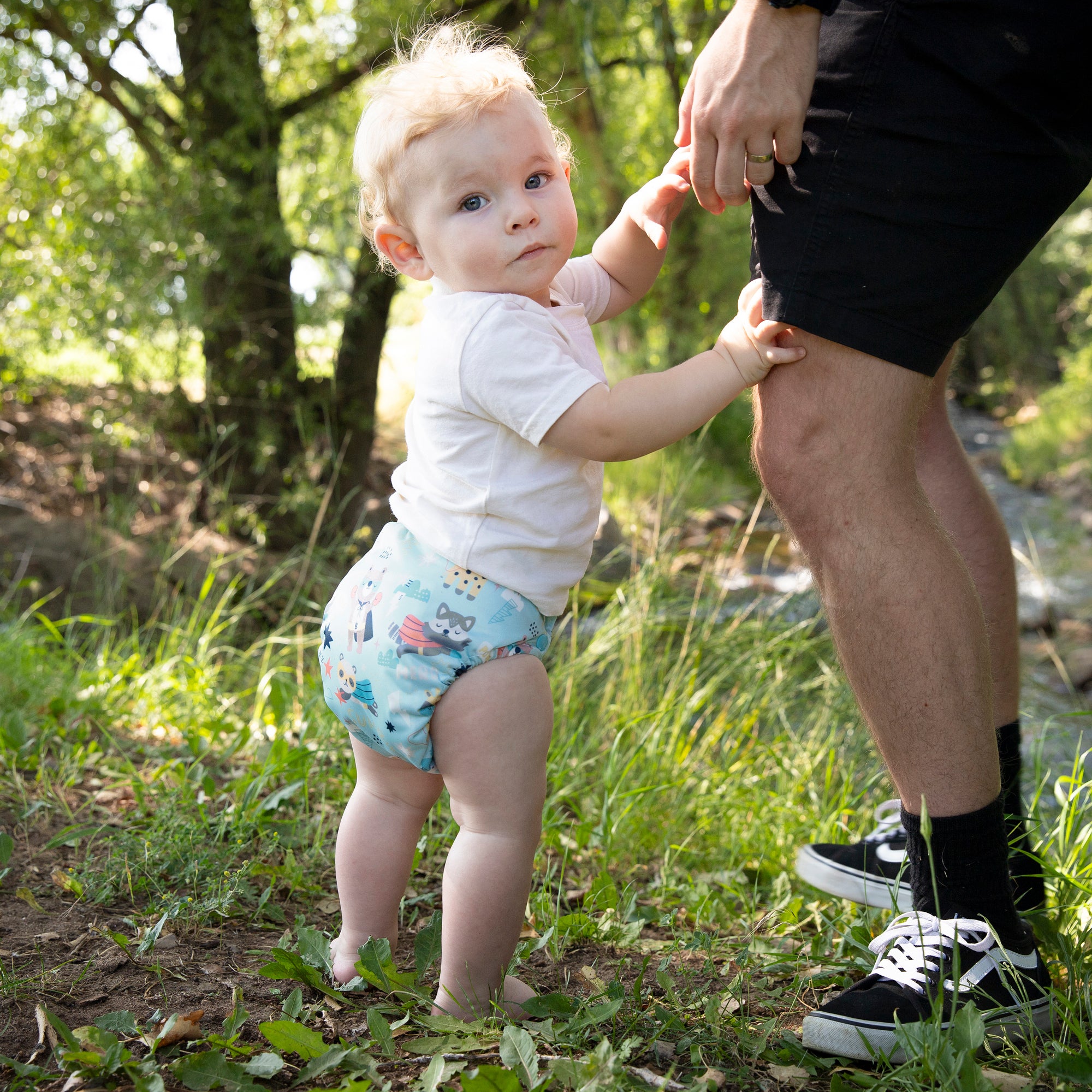 Image of Dad and baby wearing a Thirsties one size all in one cloth 