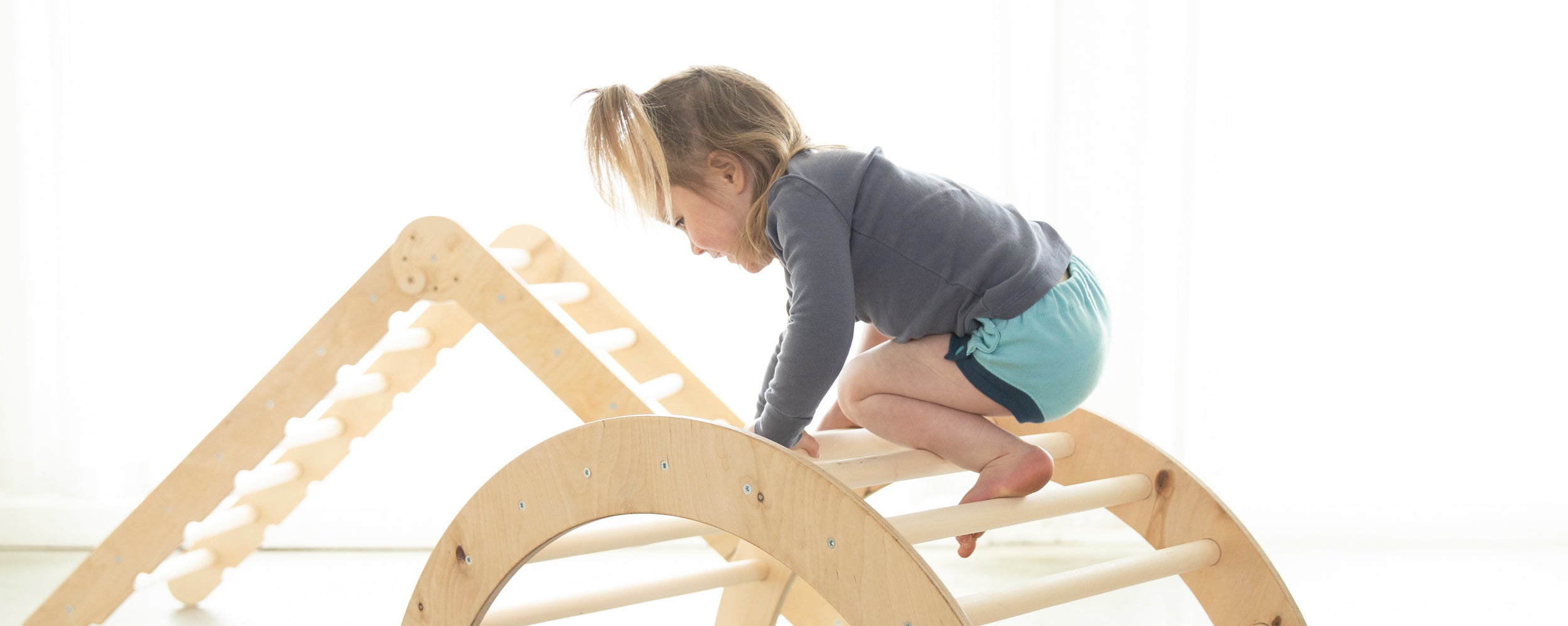 Image of Toddler wearing a Thirsties Trainer crafted from organic cotton and featuring side snap closures.