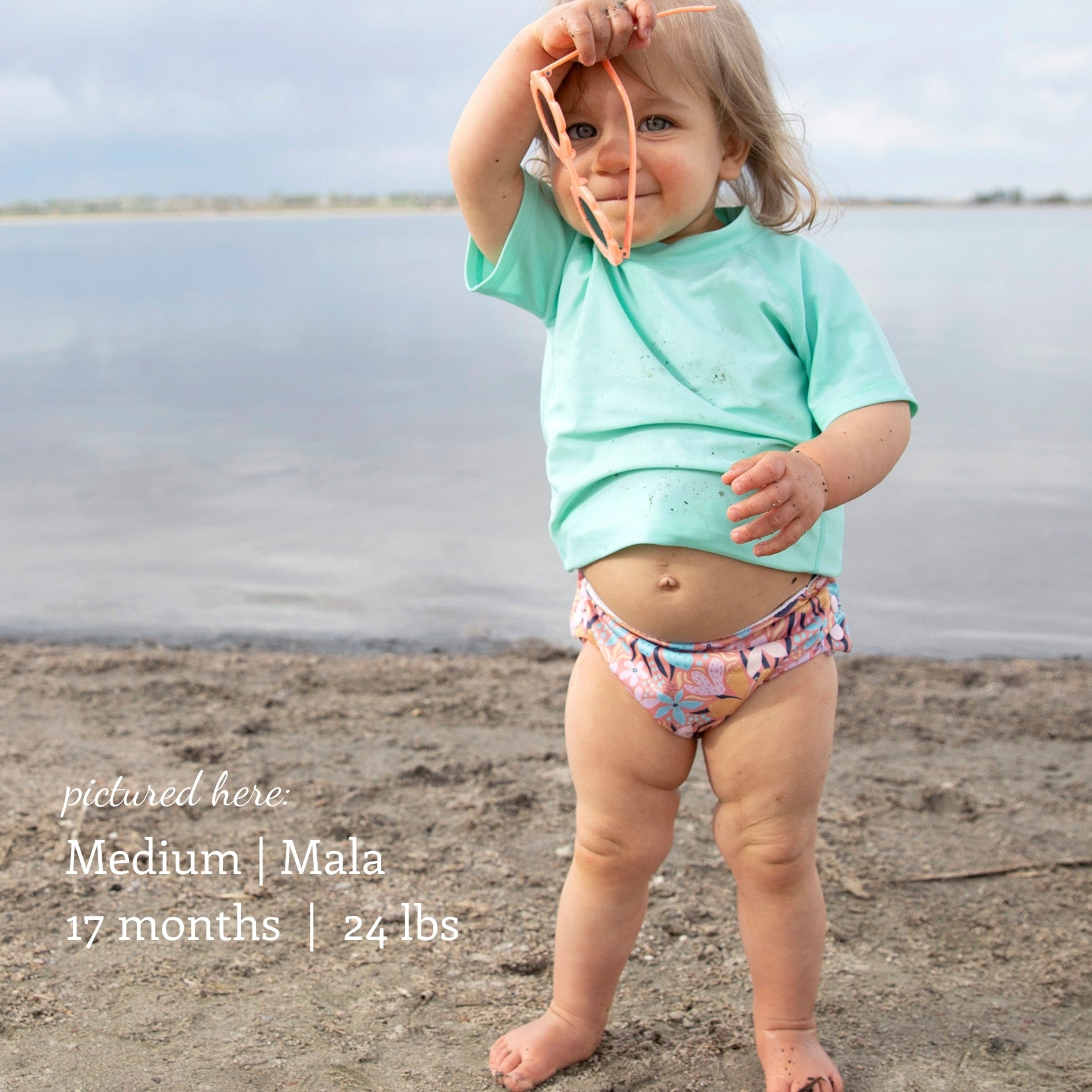 -Image of baby wearing a Thirsties Swim DIaper Size Medium