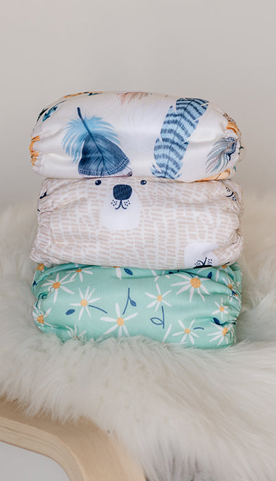 Image of stack of baby cloth diapers in Thirsties Forest Finds Collection