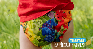 Baby bottom wearing Rainbow Harvest duo wrap and red t-shirt