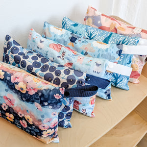 -Image of Thirsties Mini Wet Bags in a colorful and delightful selection of patterns