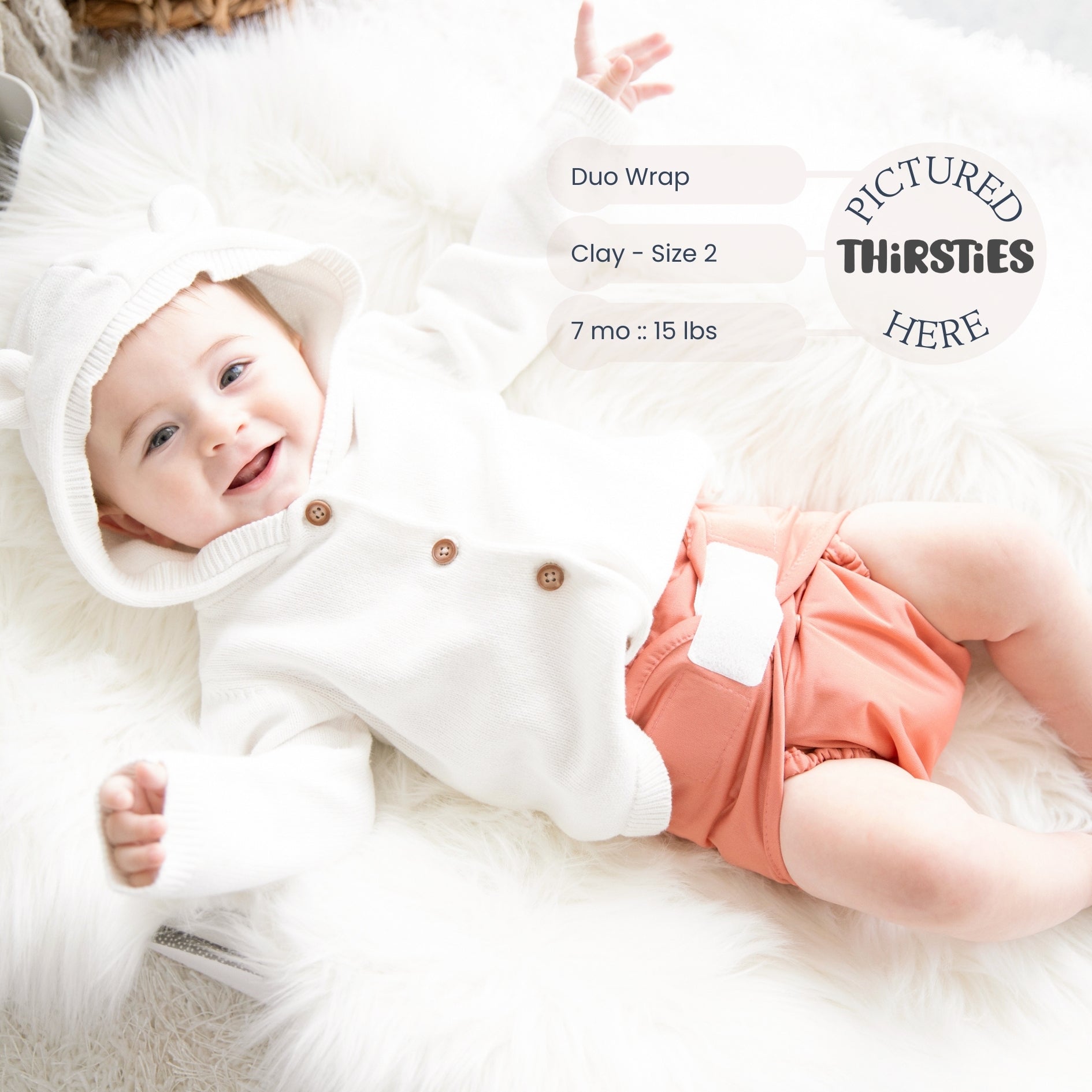 -Image of infant wearing a Thirsties Duo Wrap with hook and loop closures in clay