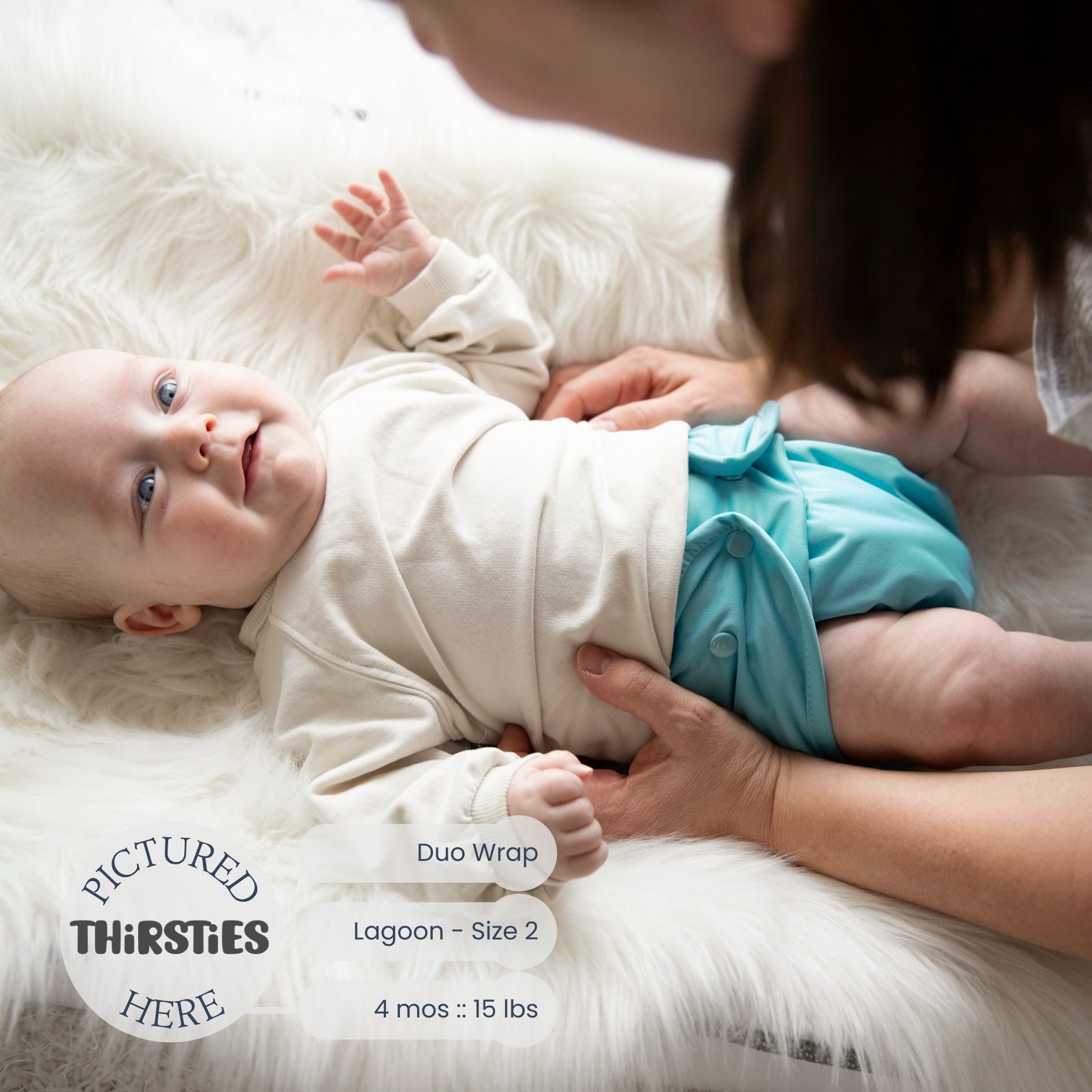 -Image of baby wearing a Thirsties Duo Wrap with snap closures in Lagoon