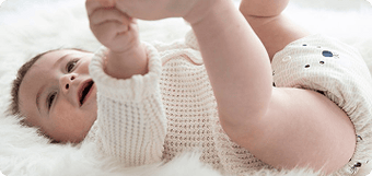 image of a baby wearing a thirsties all in one cloth diaper in bearly