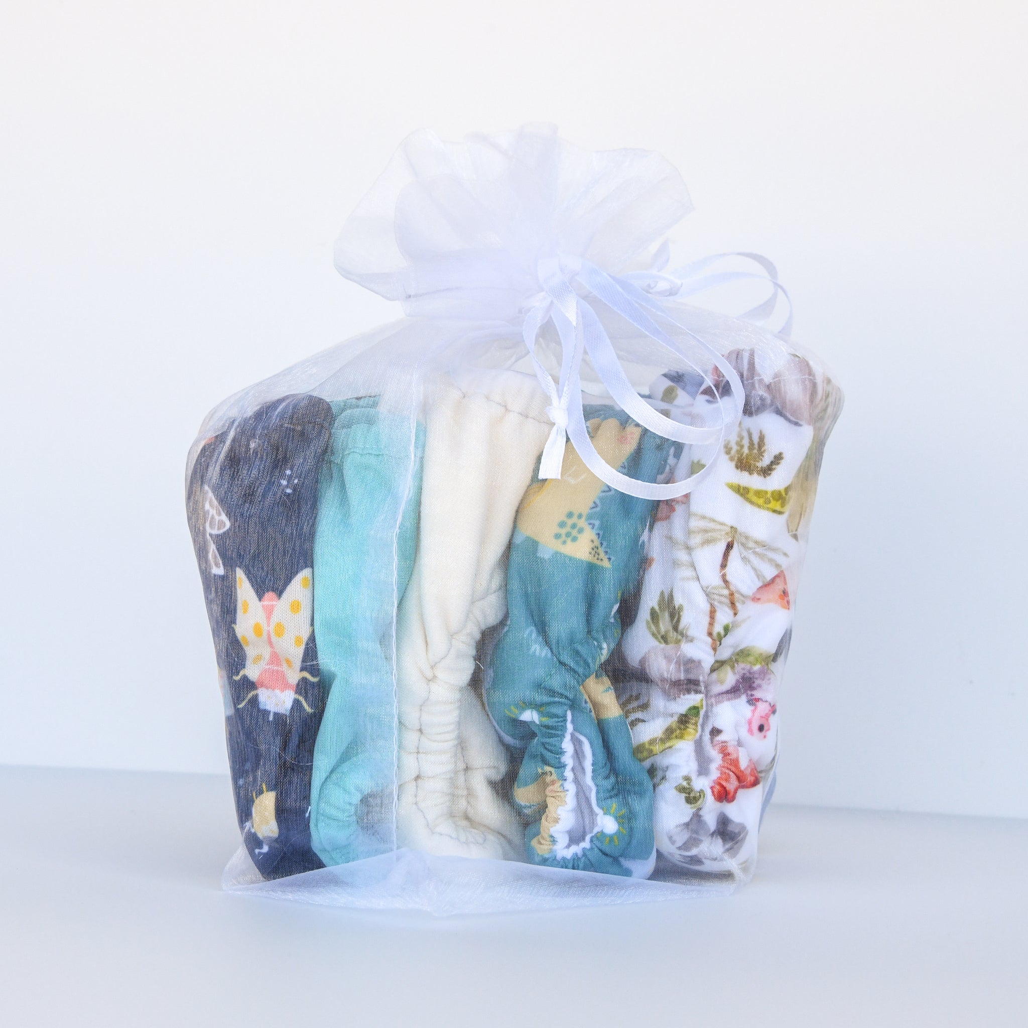 -Image of Thirsties Newborn Sampler Pack Cool Colors in organza gift bag