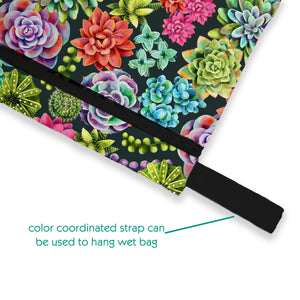 -image of mini wet bag desert bloom with color coordinated strap can be used to hang bag